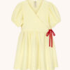 kanarkowa sukienka muślinowa, żółta sukienka z muslinu, kopertowa sukienka wiązana na kokardkę, z bawełny organicznej