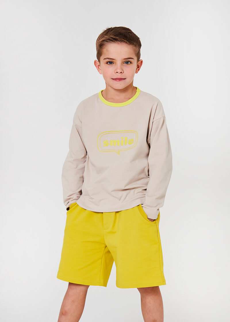 bluzka dziecięca z długim rekawem, beżowy longsleeve z nadrukiem neonowym smile, bawełniana koszulka dla dziecka