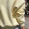 bluza damska, krótka, z dzianiny z meszkiem, drapanej, masełkowa, żółta